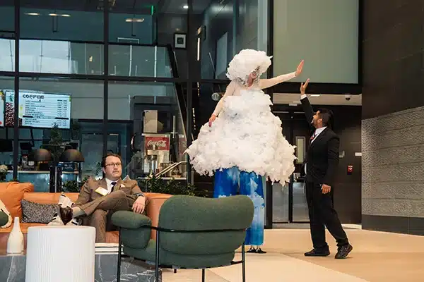 AAnywhere-NEW-1-600 People talk around standing tables at a large event